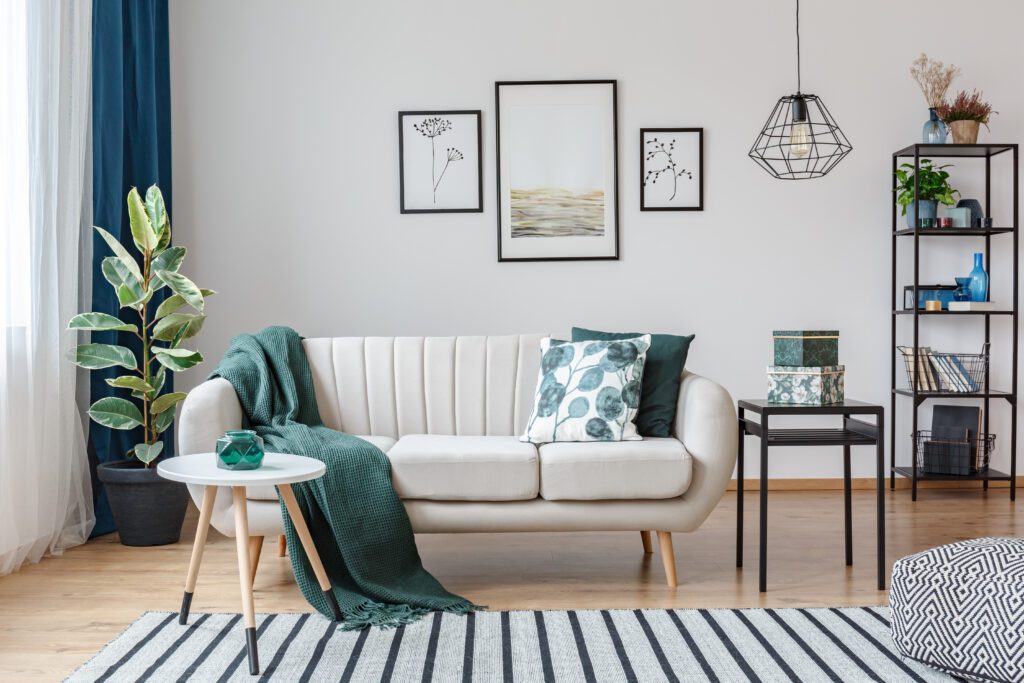 How to make a rental feel like home with simple renter-friendly decor, plants, wall art, and cozy living room setup