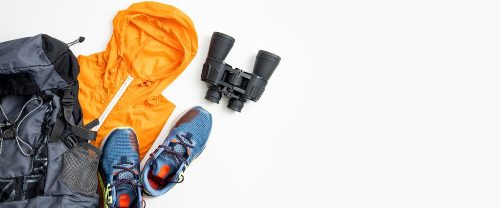 outdoor gear organization with camping equipment, storage bins, and packed supplies ready for an adventure