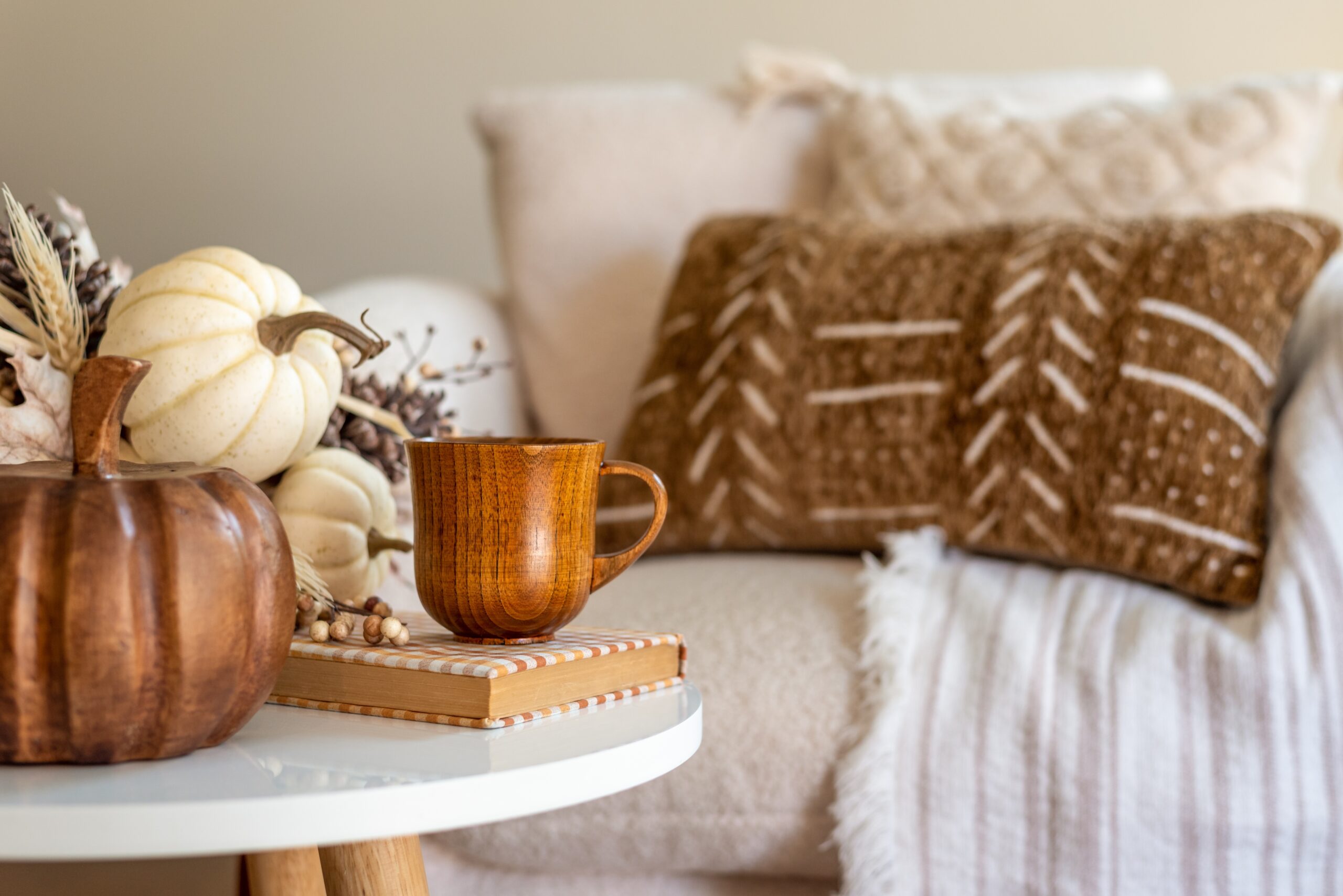 From Spooky to Cozy: Transitioning Your Home for Harvest Season - Welcome the Warmth of Fall After a Spooky Halloween - Fall home décor with cozy blankets, pumpkins, and natural textures — Guardian Storage blog