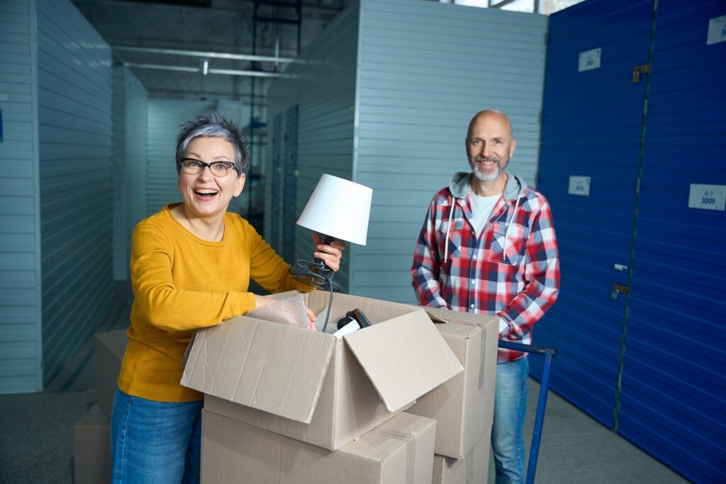 Downsizing made easy with organized storage unit and blue doors at Guardian Storage